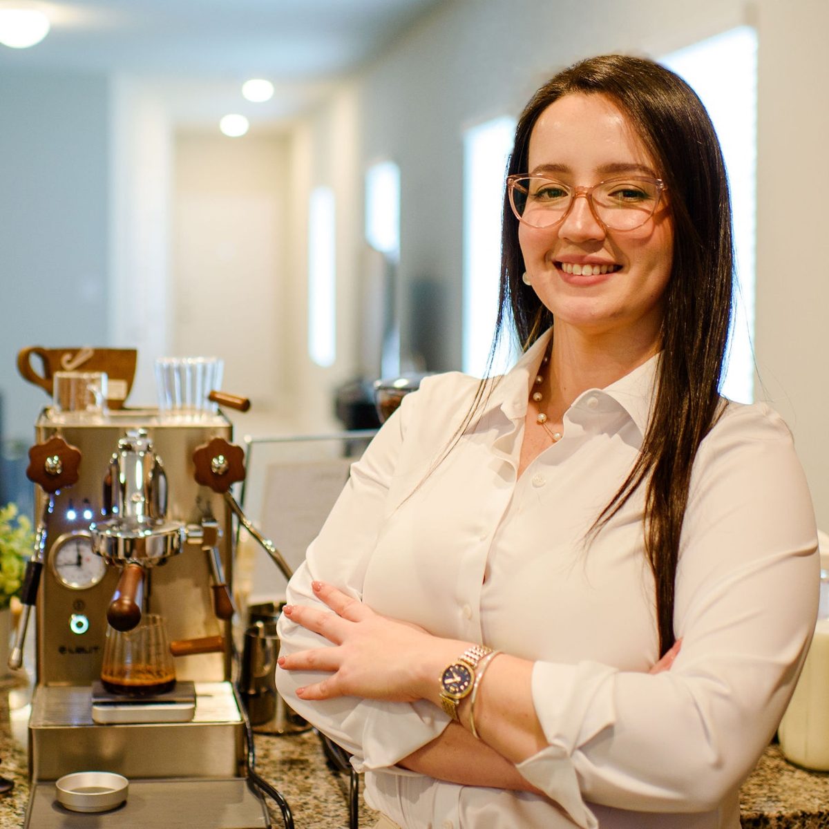 Ornella Gallo, Head Barista and Founder, next to her espresso machine